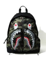 BAPE 1st Camo Shark Day Pack (SS21) - Green, showcasing the iconic Shark design and BAPE's signature camouflage pattern for a bold urban look.
