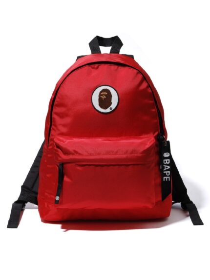 BAPE Happy New Year Ape Head Patch Backpack - Red, showcasing festive Ape Head patches to ring in the New Year with style.