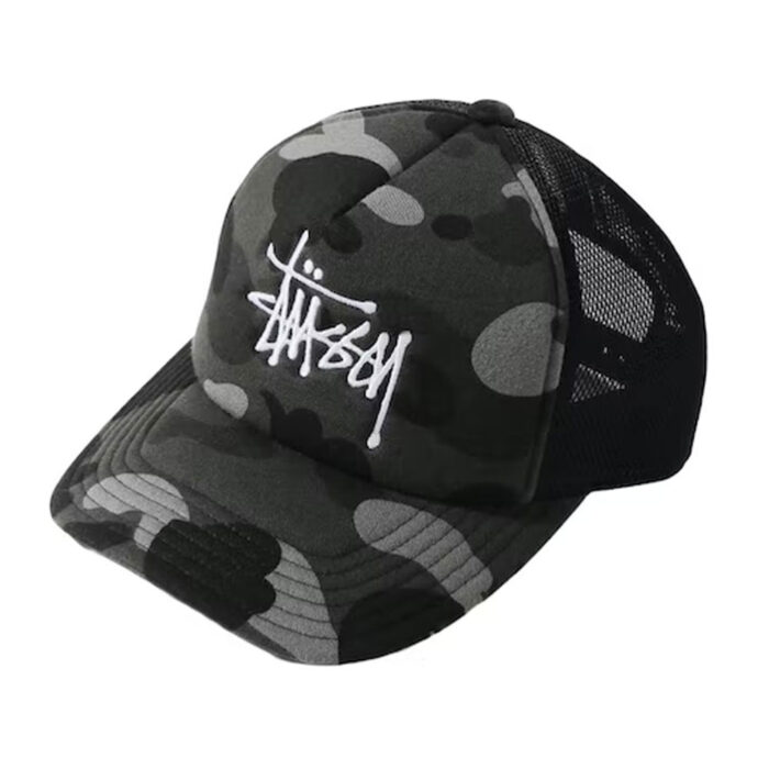 BAPE x Stussy Trucker Cap - Black, Featuring iconic logos from both BAPE and Stussy, this black trucker cap is a symbol of bold and timeless style.
